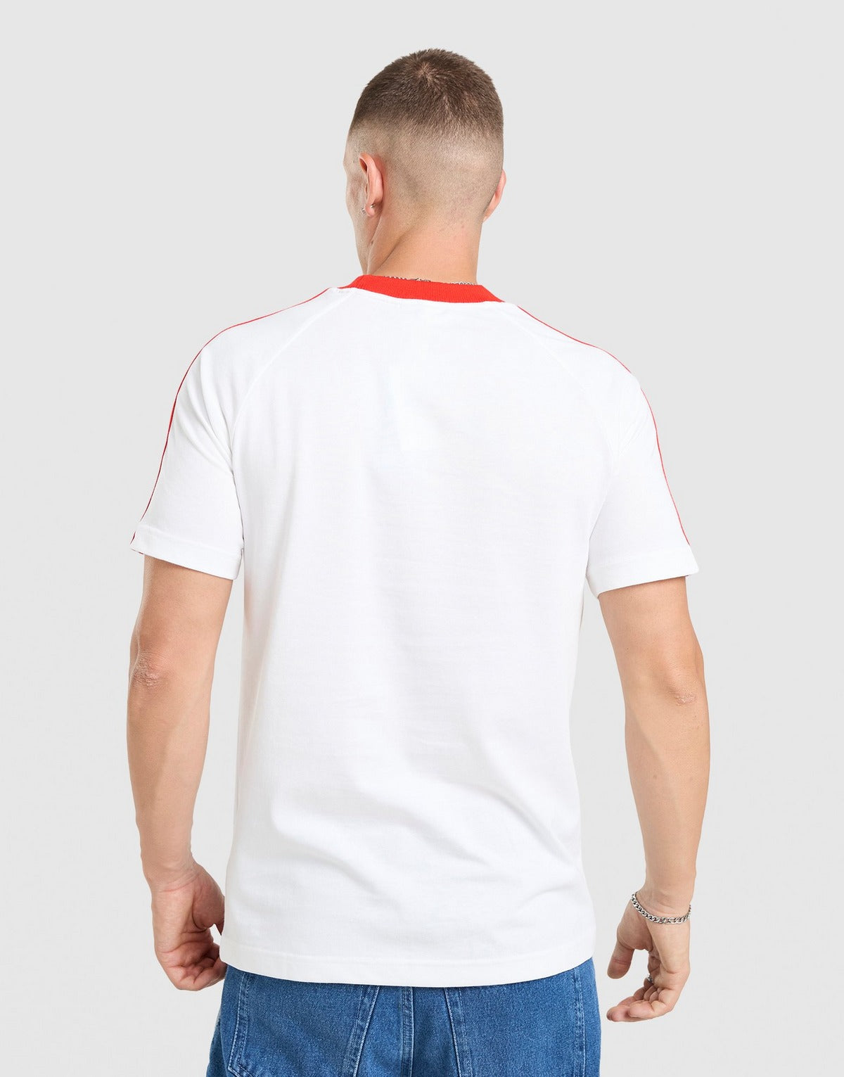 Camisola pré jogo/viagem vermelha/branca 2026/27